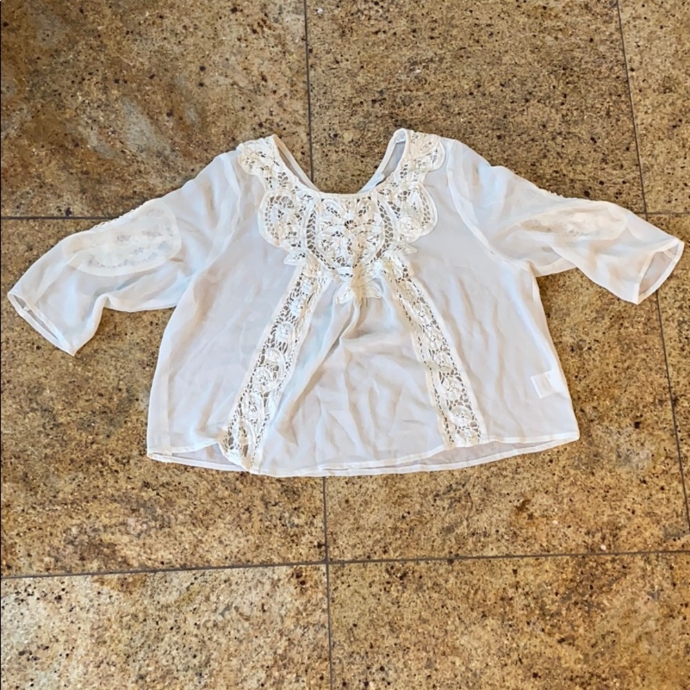 Ivory colored blouse size medium.